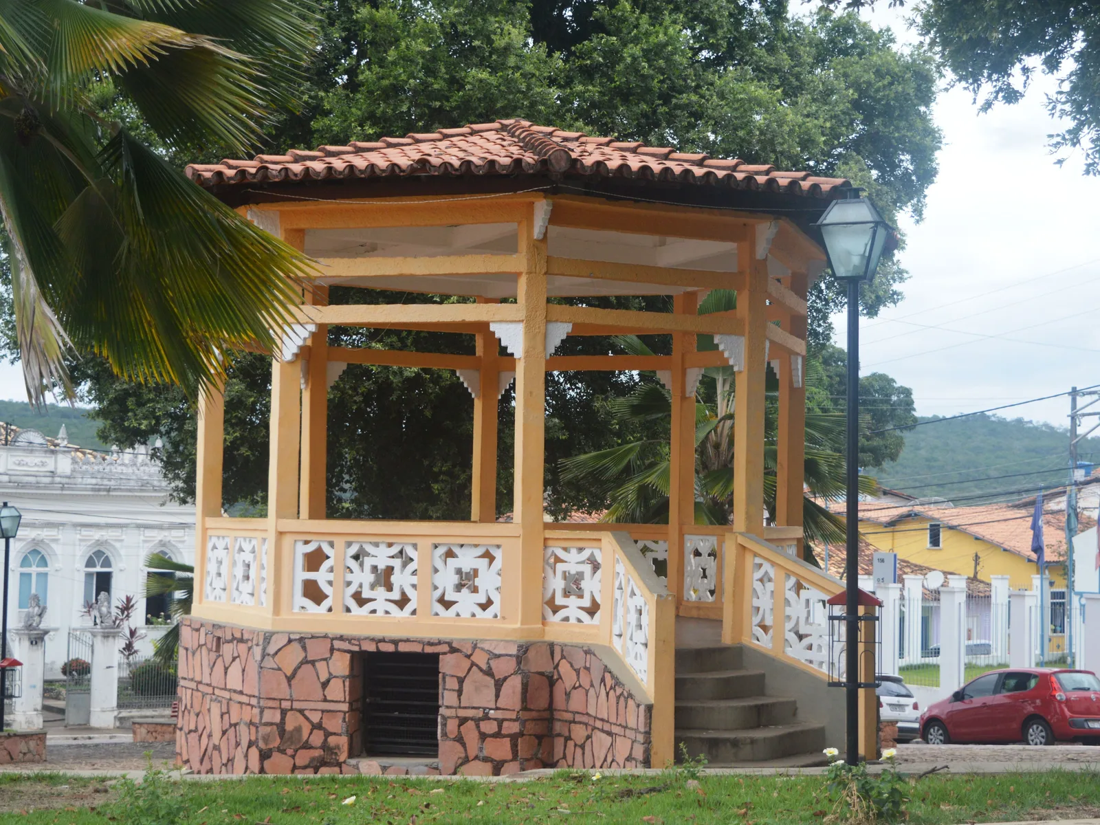The wooden bandstand in the square at Lençóis, the town in Bahia, with painted houses and palms behind it