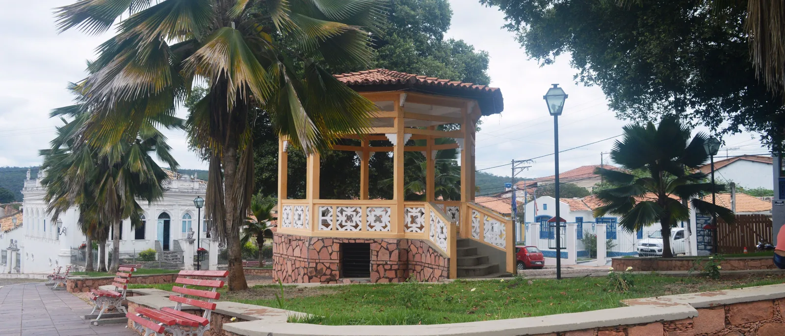 The public square of Lençóis, the town in Bahia, with its wooden bandstand under tall palms and painted houses along the far side