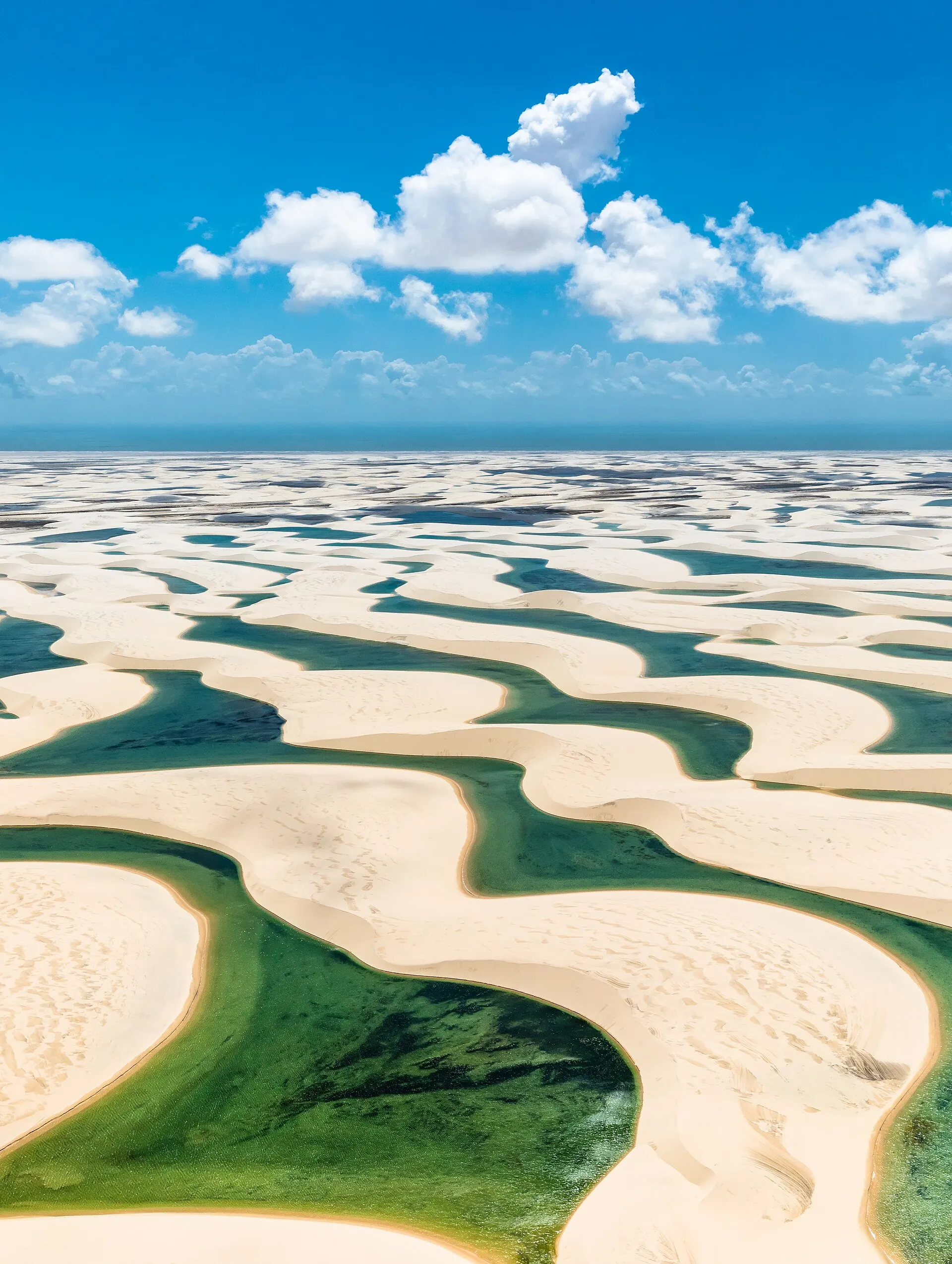 Aerial view of the white dunes and turquoise lagoons of the Lençóis Maranhenses
