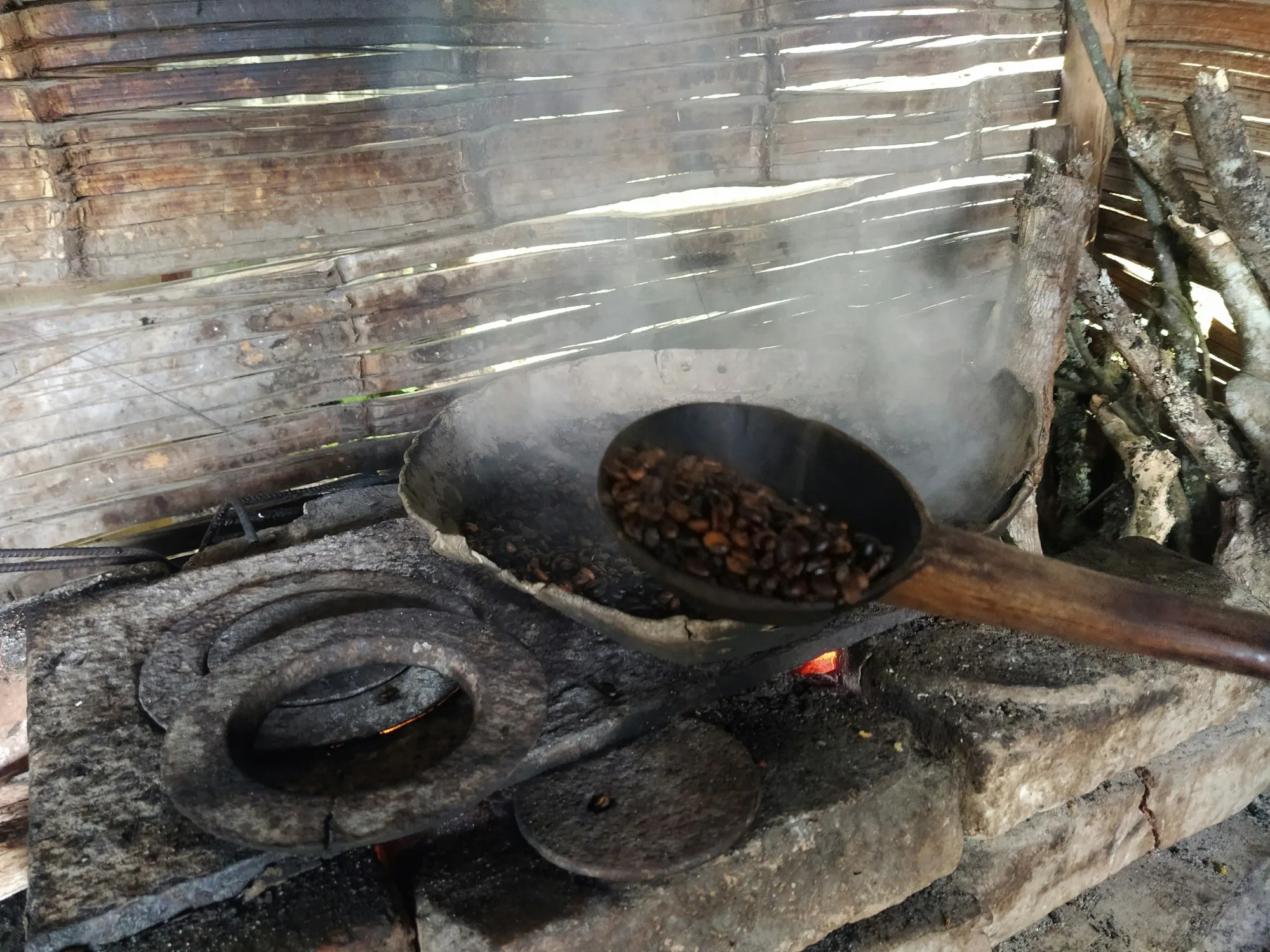 Cacao being roasted over a fire in Bahia