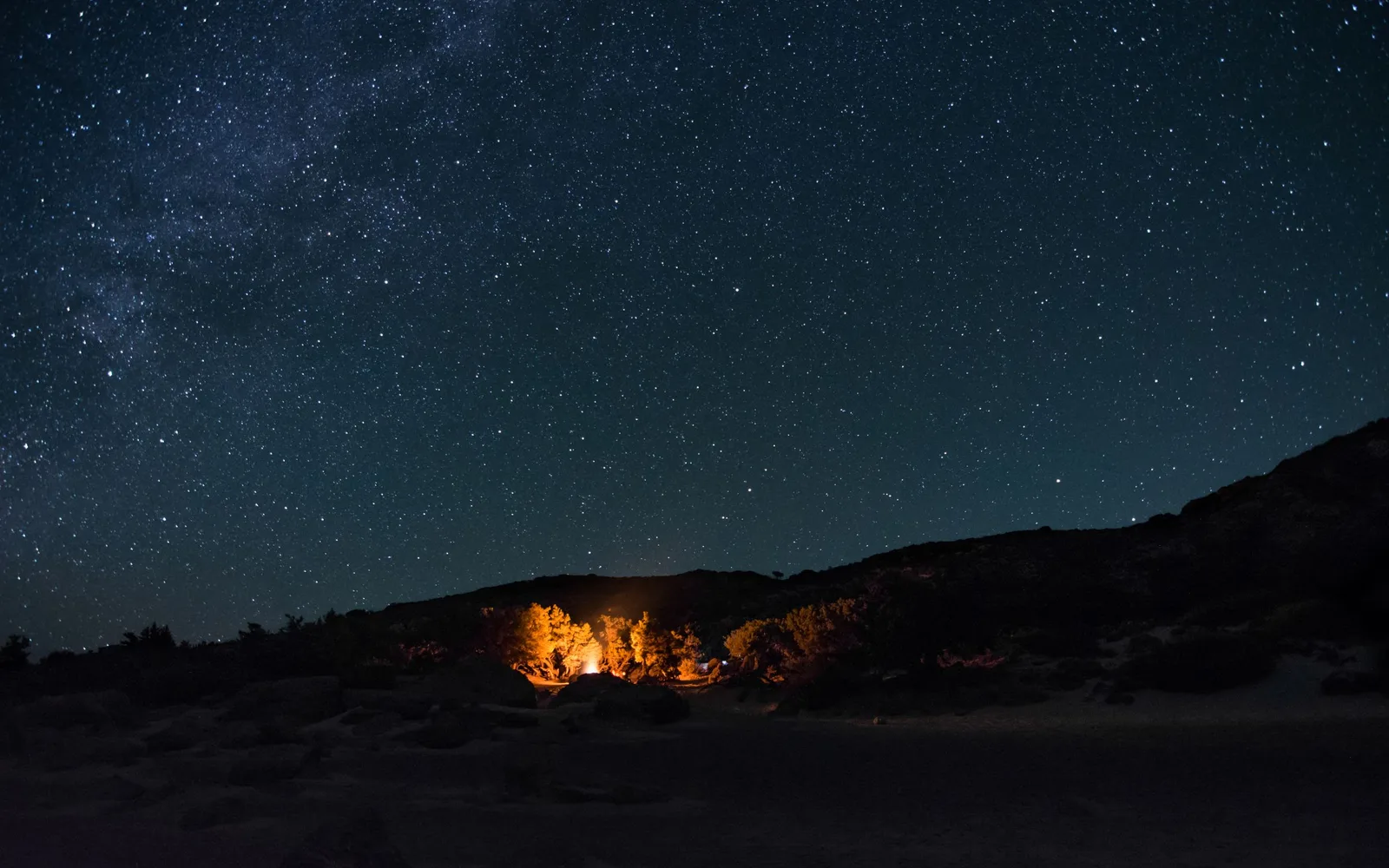 A campfire at a Pantanal fazenda after dark