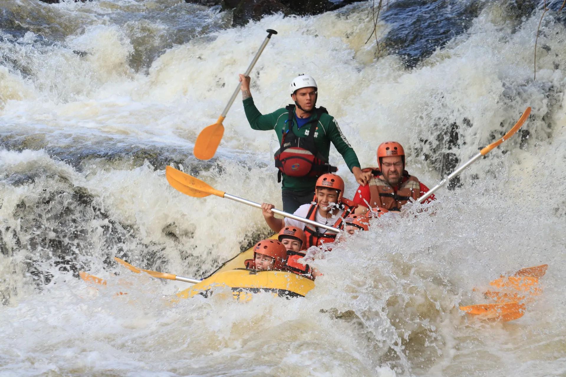 A boat taking passengers under the falls at Iguaçu