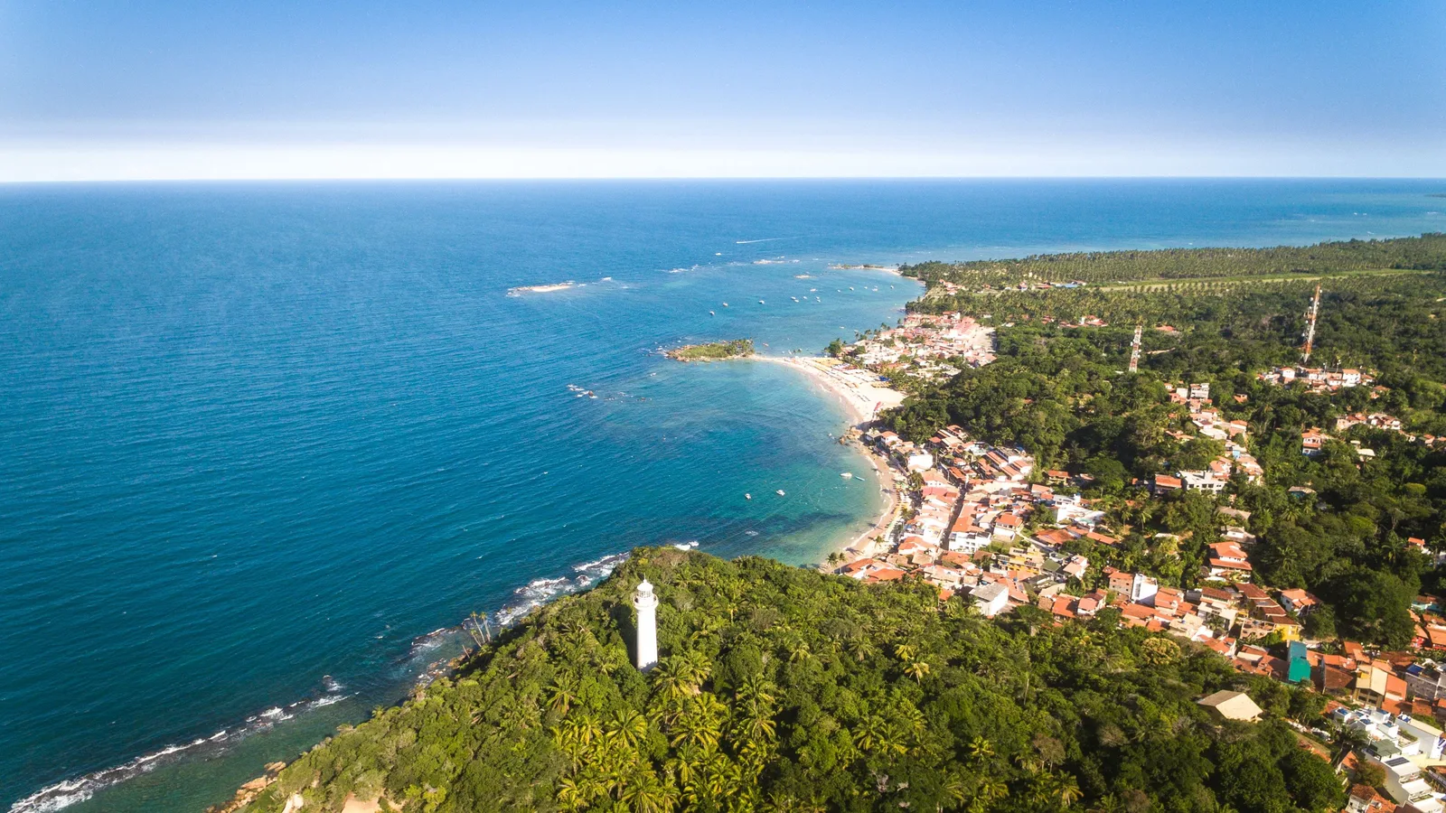 Morro de São Paulo from the air: the village and its beaches strung along the eastern shore of the island of Tinharé