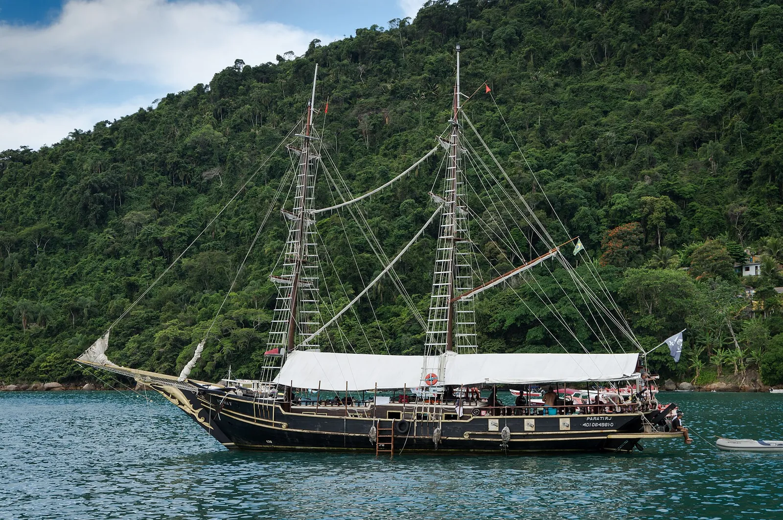 A wooden schooner anchored in Paraty Bay