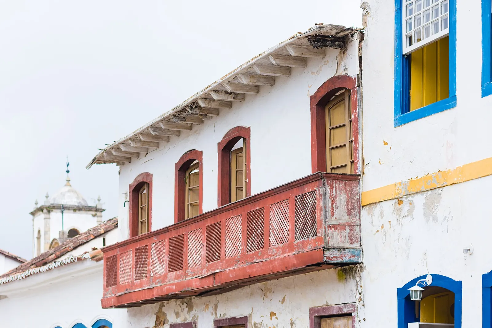 Whitewashed colonial houses on a cobbled Paraty street