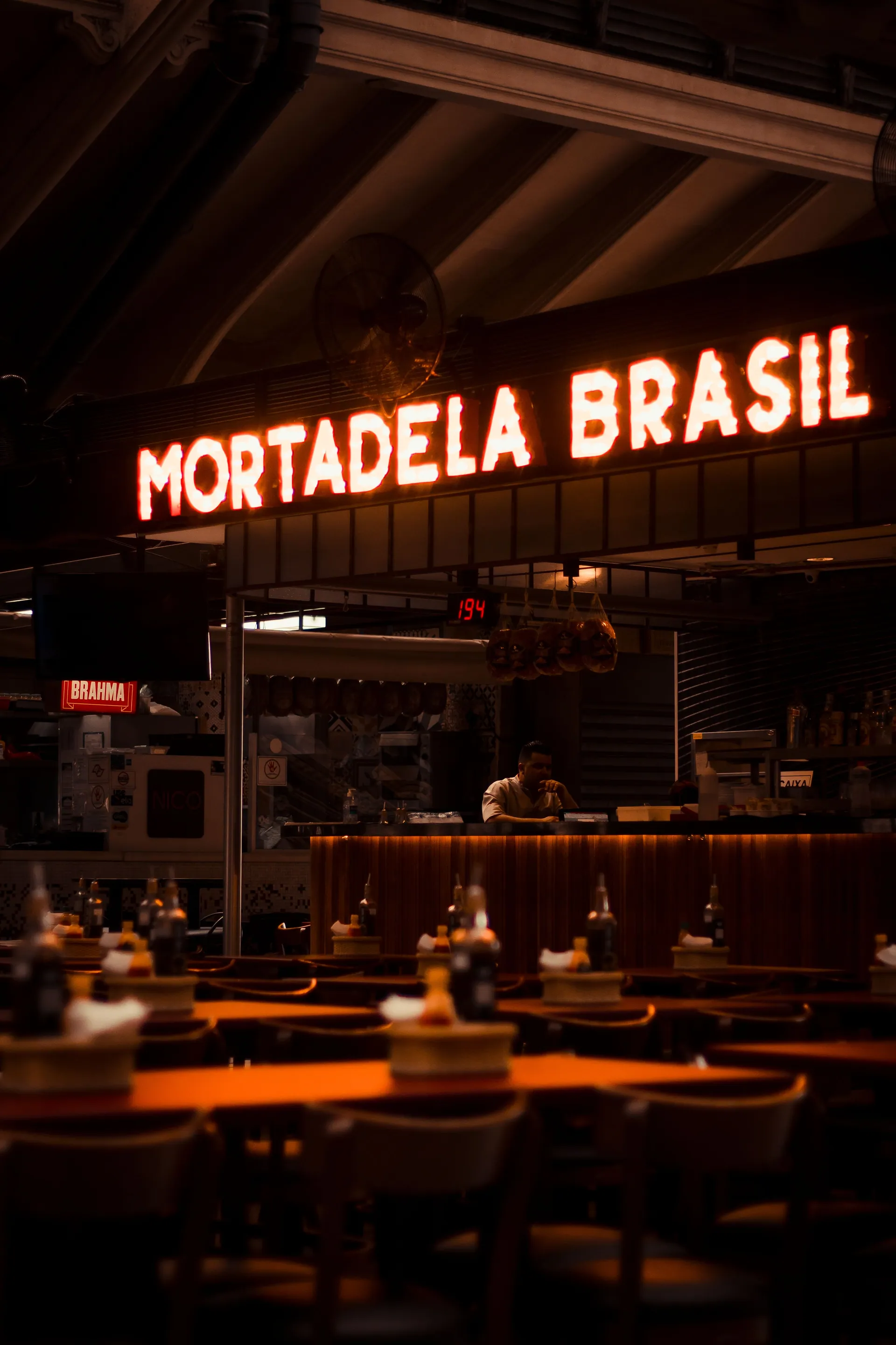 The neon-lit "Mortadela Brasil" counter inside São Paulo’s Mercado Municipal