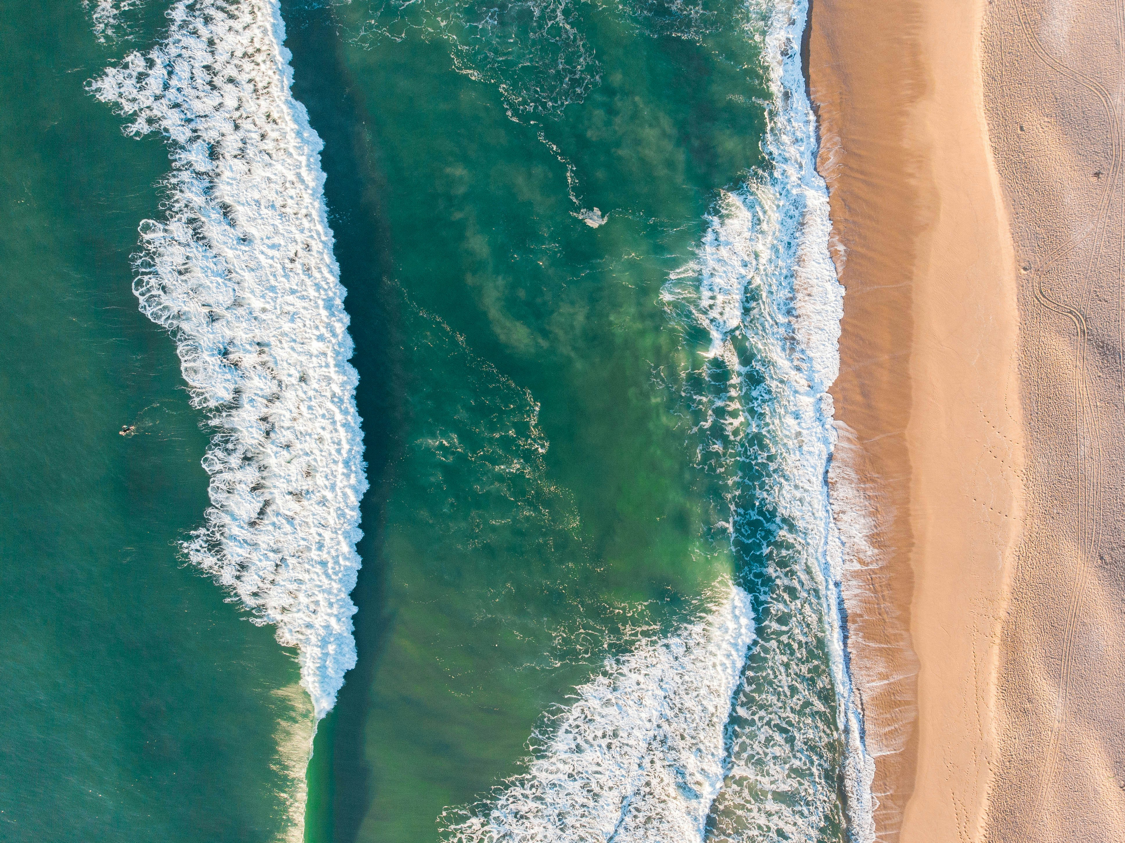 Aerial view of the pale dune field behind a Florianópolis beach